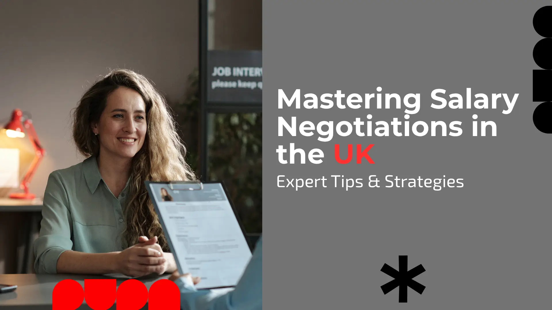 A banner for a guide on salary negotiation. The image shows a professional setting, likely a job interview, where a smiling, fair-skinned woman with long, wavy brown hair, wearing a light mint green or sage blouse, is seated across a table. She is looking directly at someone out of frame (presumably the interviewer). The interviewer's hands are visible in the foreground, holding a clipboard with a resume on it, positioned between the two people. The background is dim, showing a red lamp and a sign with partial text reading "JOB INTERVIEW please keep q...". The right side of the banner is a solid dark gray field containing the white title text: "Mastering Salary Negotiations in the UK," where 'UK' is highlighted in red. Below the title is the subtitle: "Expert Tips & Strategies." The gray field also features abstract, black geometric shapes, including stacked circles in the top right and a large asterisk-like symbol near the bottom center. A red, abstract geometric logo is partially visible in the bottom left corner.